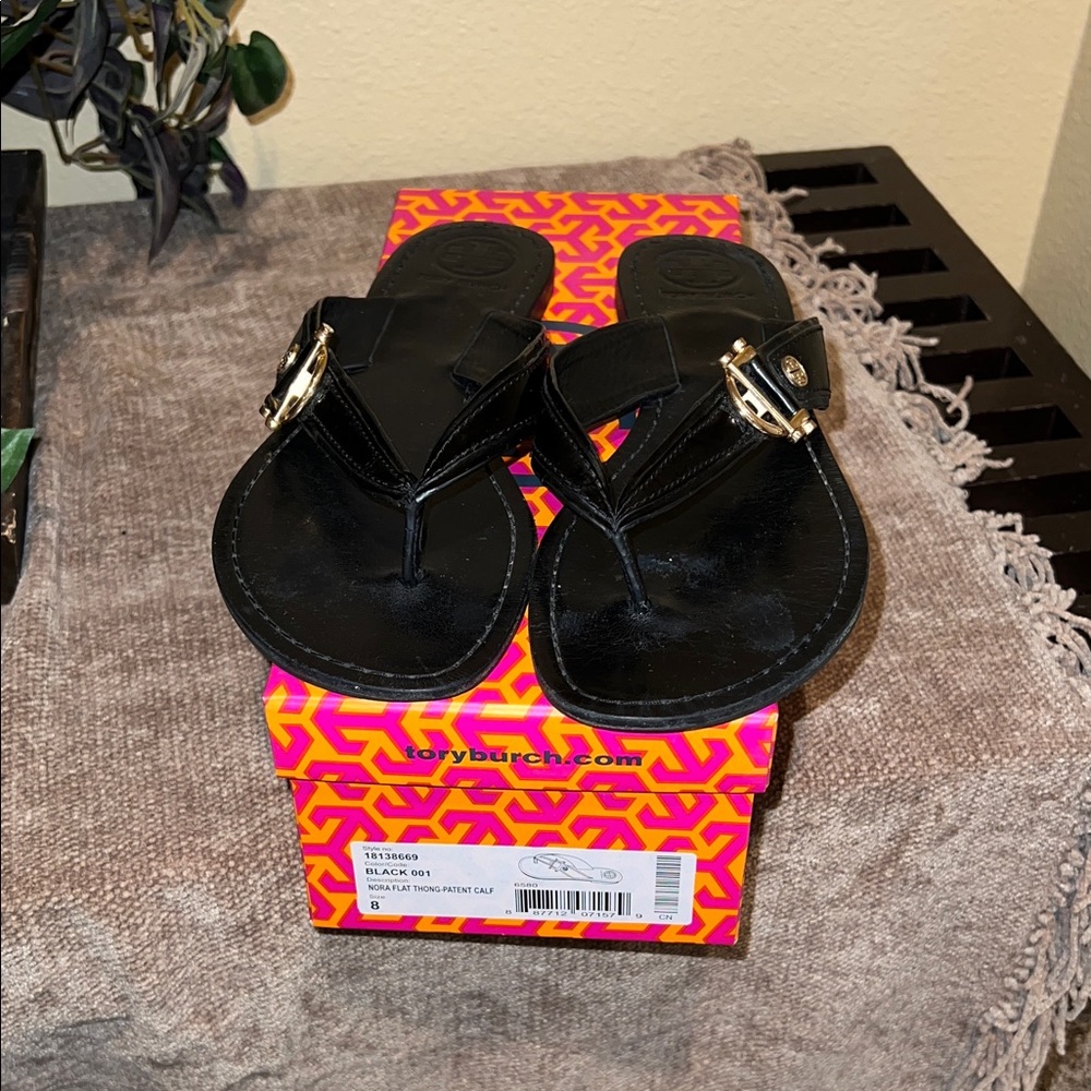 Tory Burch Black Sandals with Gold Accents